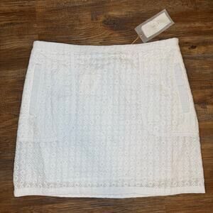 Esley 100% Cotton white eyelet skirt size Medium mini skirt has pockets NWT